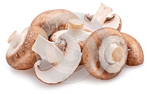 Brown cap champignons with slices of champignon mushroom isolated on white background. Close-up