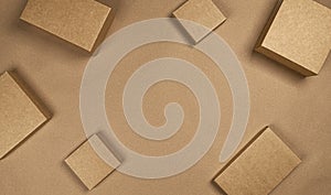 Brown cardboard boxes on craft paper background, top view