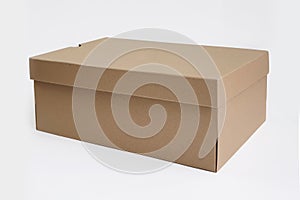Brown cardboard shoes box with lid for shoe or sneaker product packaging mockup, isolated on white background with clipping path.