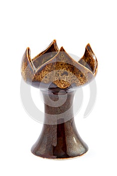 Brown ceramic candlestick isolated on white background