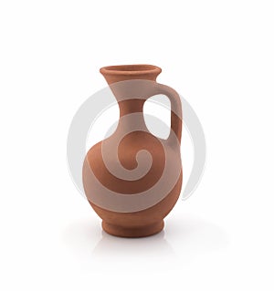 Brown ceramic jug taken closeup isolated on white background