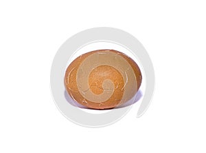 Brown chicken egg, cracked eggshell on a white background. isolate