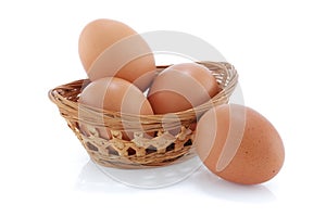 Brown chicken eggs in a bamboo basket