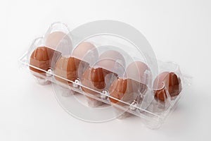 Brown chicken eggs in  a plastic package