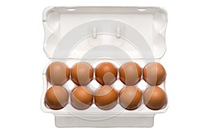 Brown chicken eggs in a plastic package on a white background