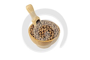 brown chickpeas in wooden bowl and scoop isolated on white background.