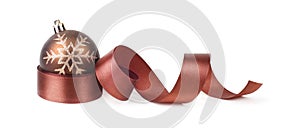 Brown Christmas ball and ribbon on white horizontal background