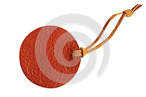 Brown circle leather price tag with leather cord isolated on white background