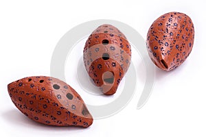 Brown clay Ocarina on a white background