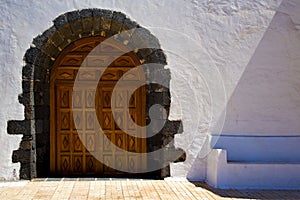 A brown closed wood church door spain canarias photo