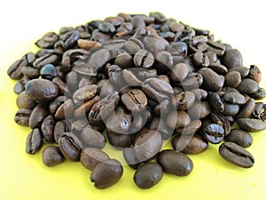Brown coffee bean drink on yellow background