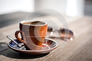 Brown Coffee mug, sunny day with glasses