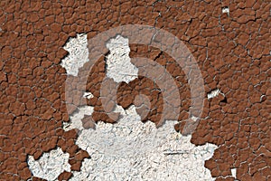 Brown color cracked painted wall pattern.