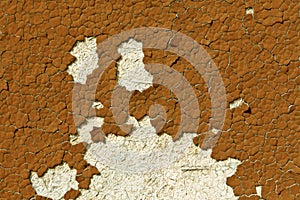 Brown color cracked painted wall pattern.