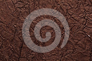 Brown color handmade paper of crumple or wrinkle texture with veins and fibers. Useful for background, 3d rendering.