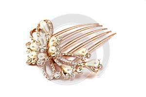 A brown colored hairpin comb with floral design inlaid with artificial pearls and diamonds