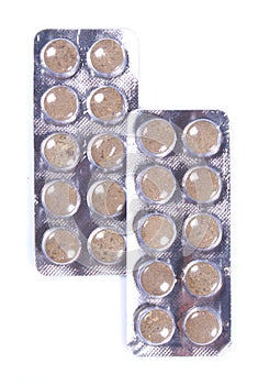 Brown colored medicine tablet blisters.