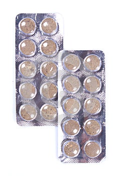 Brown colored medicine tablet blisters. photo
