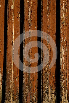 Brown colored old wood plank texture as background.