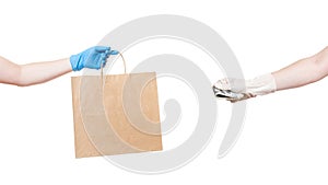 A brown craft paper eco friendly package holds the hand of a delivery.