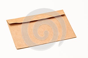 Brown craft paper envelope isolated on white