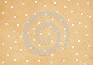 Brown craft paper with polka dot painting