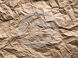 Brown crumpled craft paper background. Old texture eco waste recycling concept