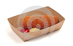 Brown crusty dutch kroket with mustard and ketchup isolated