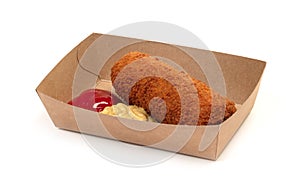 Brown crusty dutch kroket with mustard and ketchup isolated