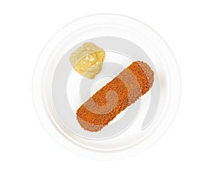 Brown crusty dutch kroket with mustard on a white plate isolated