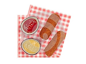 Brown crusty dutch kroketten on a red napkin isolated