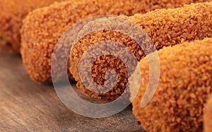 Brown crusty dutch kroketten on a serving tray isolated