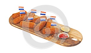 Brown crusty dutch kroketten on a serving tray isolated