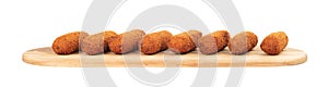 Brown crusty dutch kroketten on a serving tray isolated