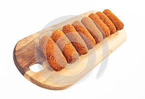 Brown crusty dutch kroketten on a serving tray isolated