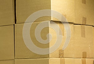 Brown different cardboard boxes arranged in stack. texture. background. Tape mounted. Transportation bags.