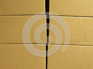 Brown different cardboard boxes arranged in stack. texture. background. Tape mounted. Transportation bags.