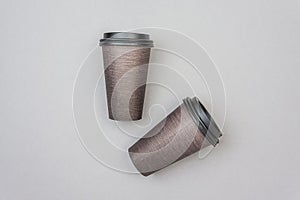 Brown disposable cardboard Coffee or Tea cups on light gray backdrop