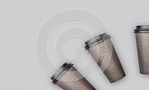 Brown disposable cardboard Coffee or Tea cups on light gray backdrop