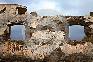 Brown distorted window in a broke paint anzarote spain