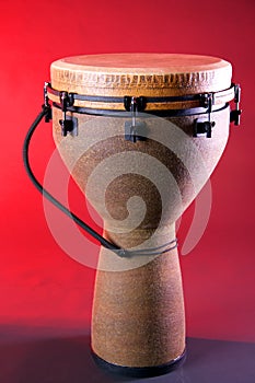 Brown Djembe Isolated On Red