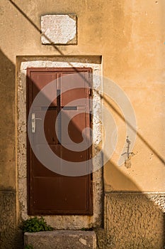 Brown door with a cross