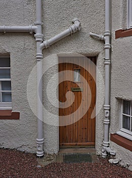 Brown Door on White Wall