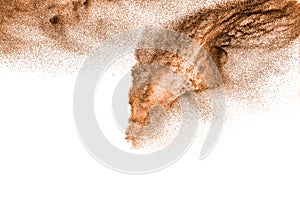Brown dry river sand explosion isolated on white background. Abstract sand splashing