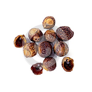 Brown dry soap nuts Soapberries, Sapindus Mukorossi for organic laundry and gentle natural skin care isolated on white