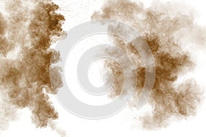 Brown dust cloud.Brown particles splattered on white background
