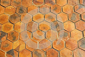 Brown earthenware floor tile seamless background and texture