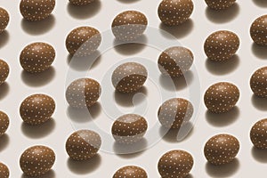 White dotted brown easter eggs flat lay