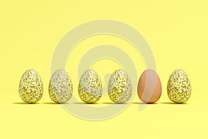 Brown egg among yellow mosaic eggs on yellow background