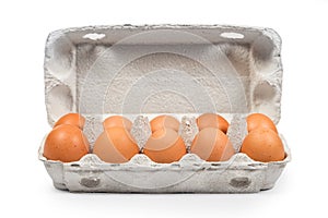 Brown eggs at cardboard package box front view